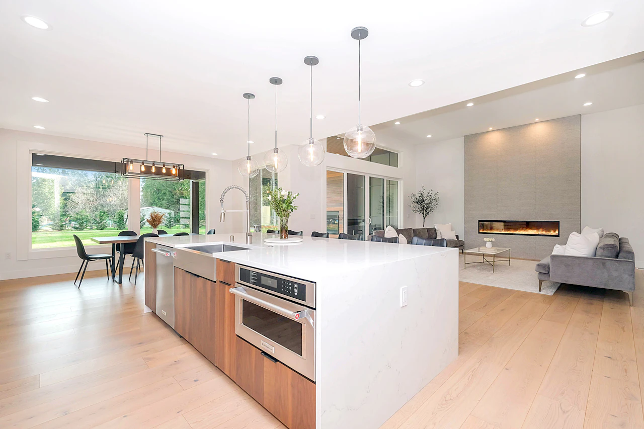 Open-plan kitchen with a long white island