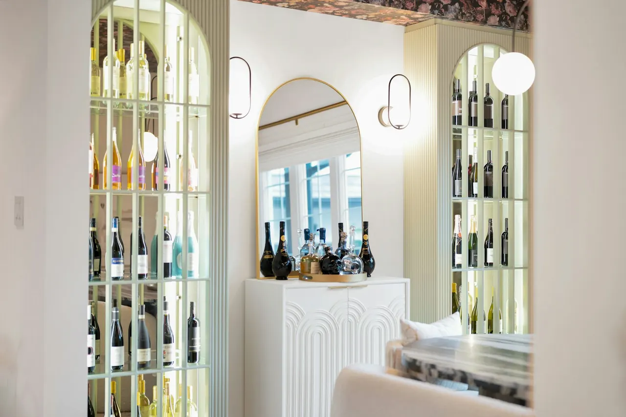 Arched wine display cabinets with lighting
