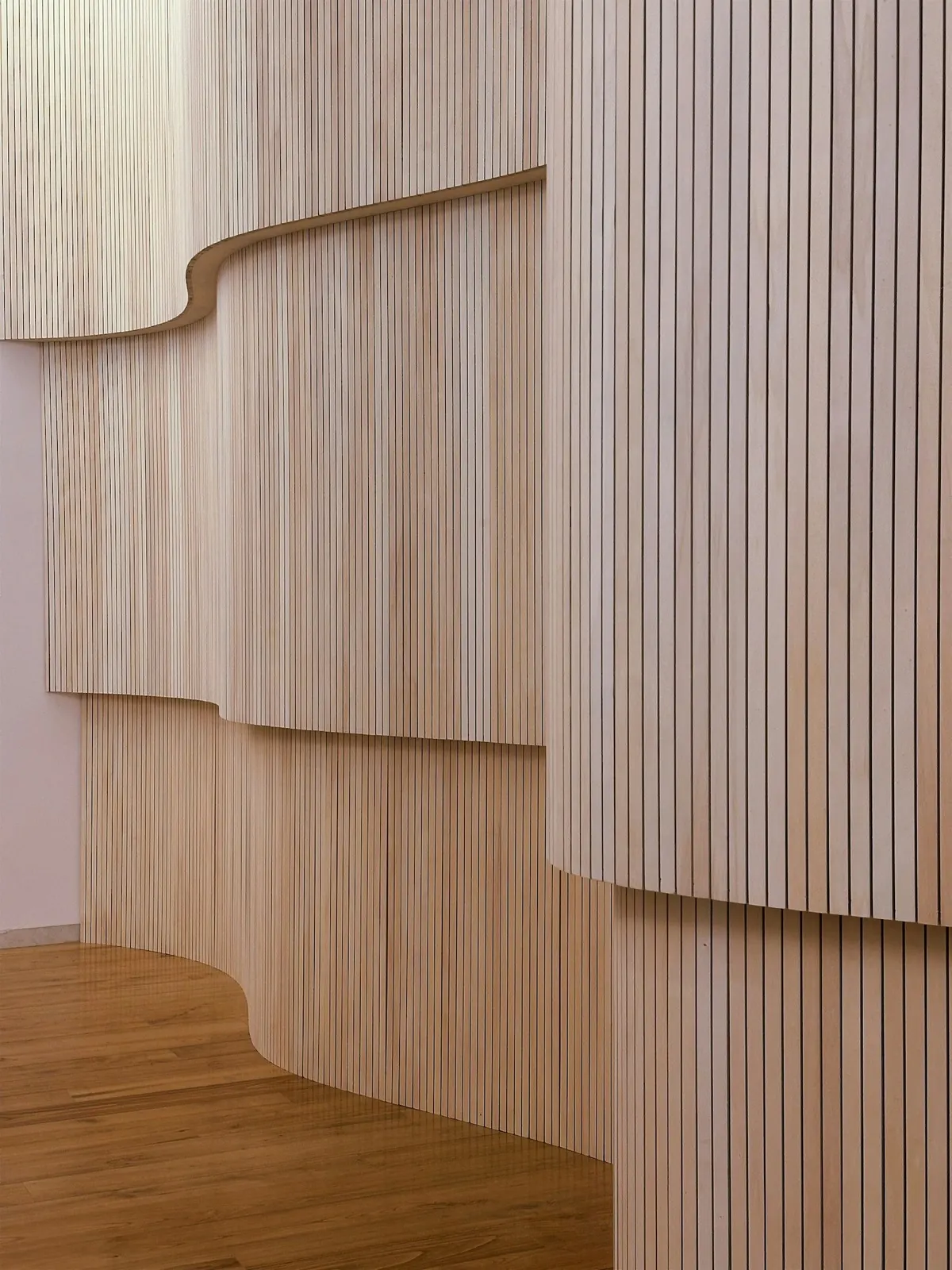 Curved wall with vertical wood slats