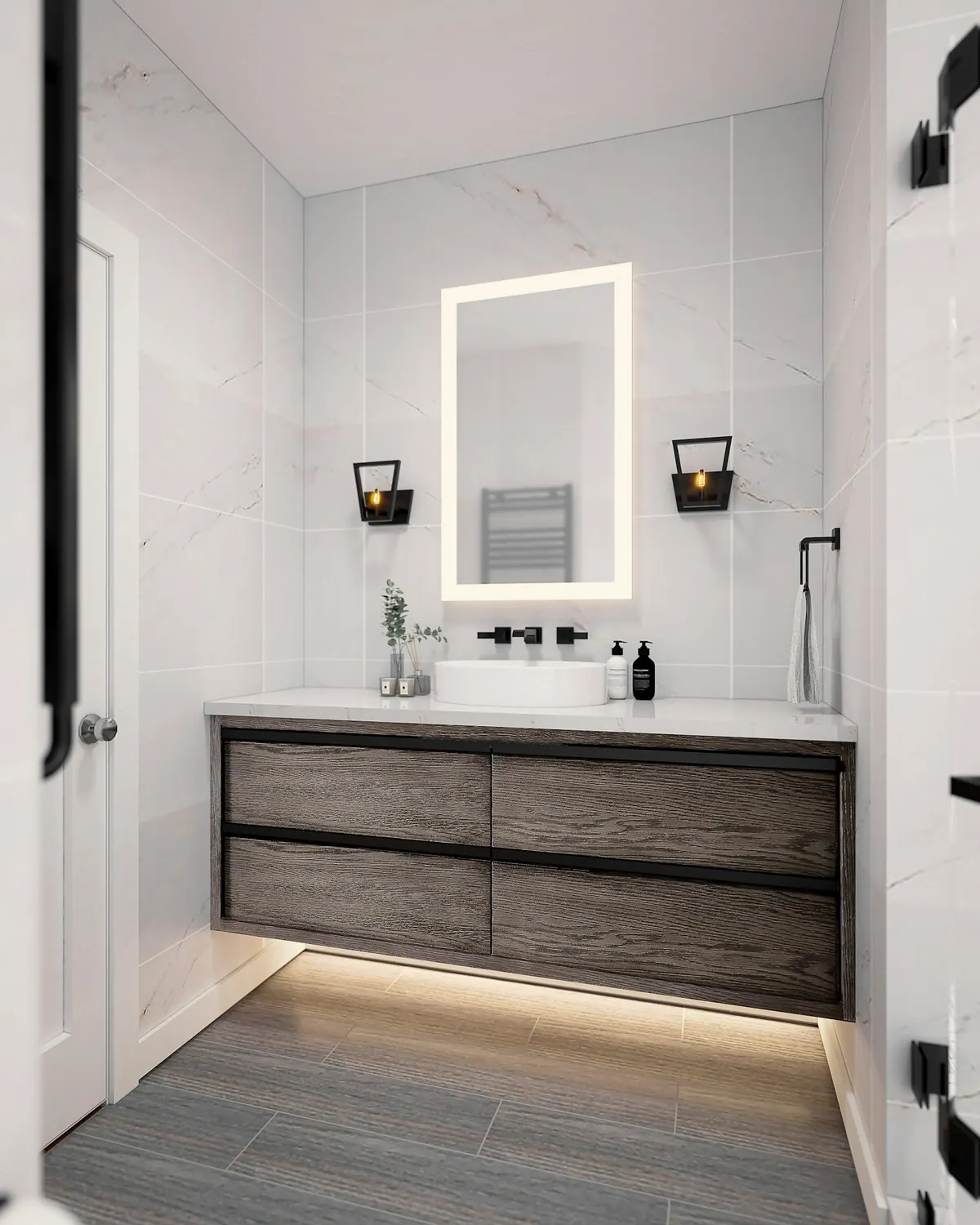 Floating wood vanity with a lit mirror