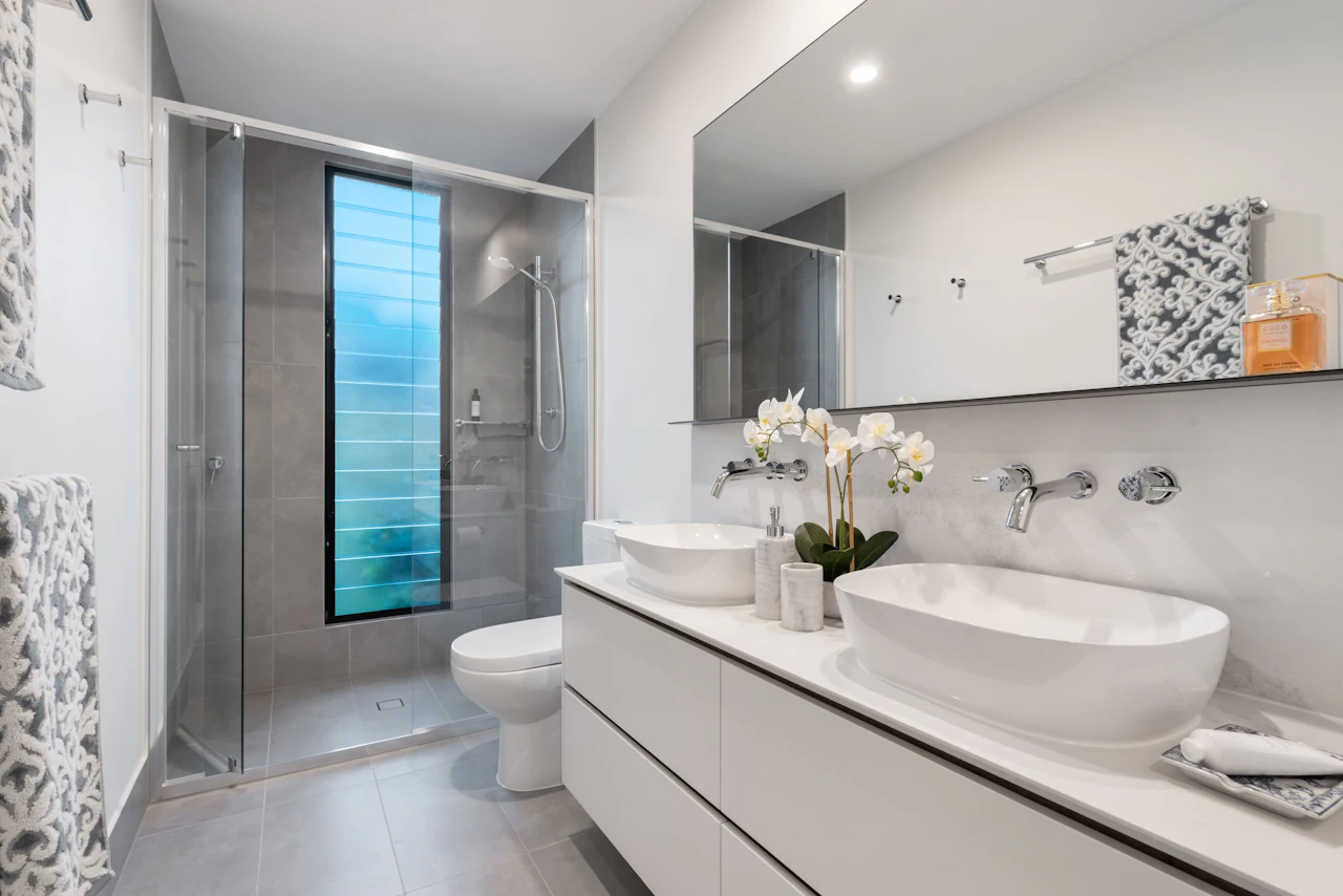 White bathroom vanity with a vessel sink